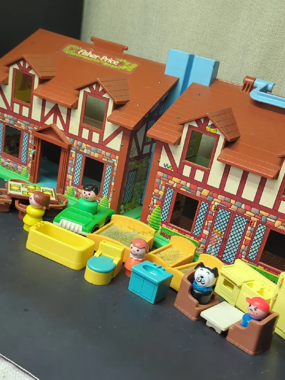 B) Fisher-Price Tudor House #952 brown & white, 2-story house complete w/Nursery